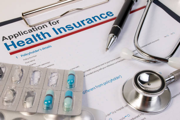 istock Application form for health insurance, paperwork, questionnaire, pen, tablet and stethoscope. 671870698