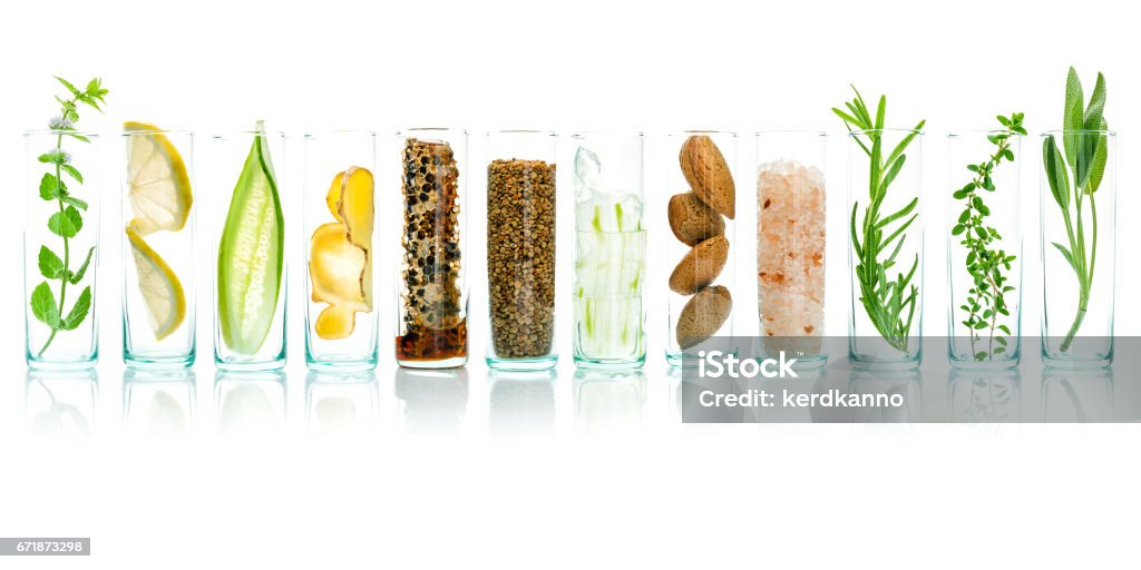 Homemade skin care with natural ingredients aloe vera, lemon, cucumber, himalayan salt, peppermint, rosemary, almonds, cucumber, ginger and honey pollen isolated on white background. Nature Stock Photo