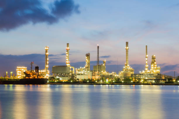 istock Oil refinery power plant river front 671873690