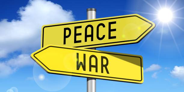 istock Peace, war - yellow road-sign 671873770