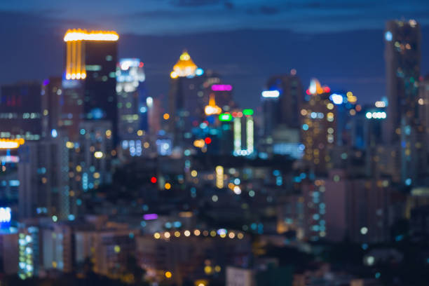 istock Night blurred bokeh city light office building 671873780