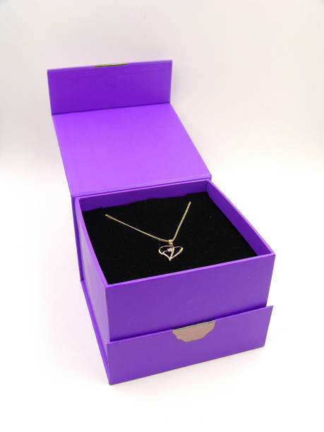 istock Gold Necklace with heart pendant in a gift box 671877494