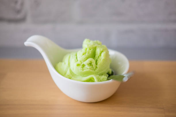 istock Lime ice cream in a white bowl close up 671879590