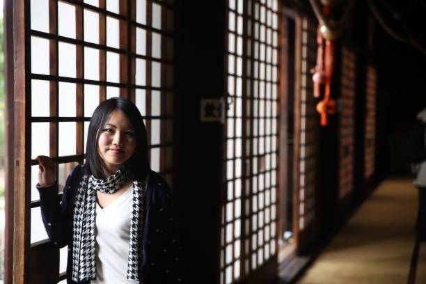 istock Young Japanese lady at Japanese temple 671880438