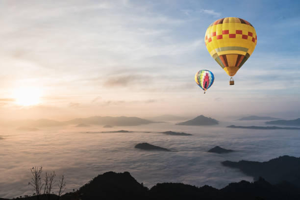 istock balloon over fog and cloud mountain valley landscape 671888600