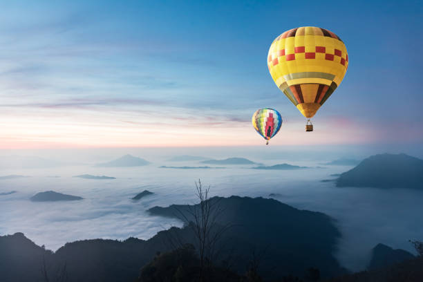 istock balloon over fog and cloud mountain valley landscape 671888618