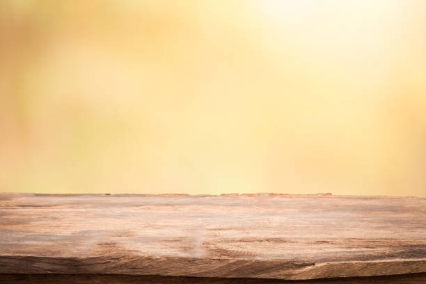 istock Empty table top on blurred nature background,Space for placing products,Warm light from the sunset 671889220