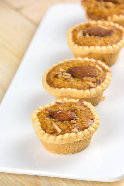 istock Homemade Almonds tart on white  plate 671889832