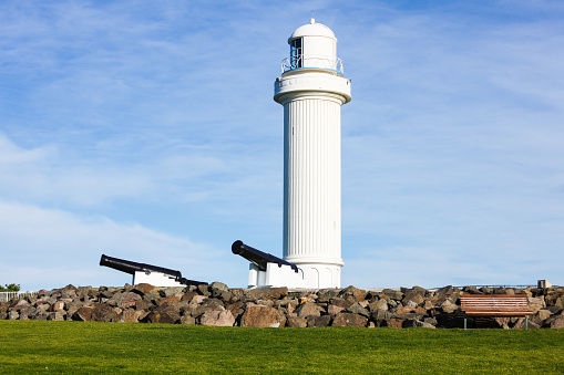 Lighthouse on a hill, with defensive cannons placed early in Wollongong's settlement