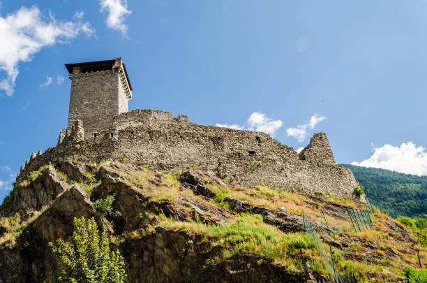 istock middleages castel on top of the mountain 671898642