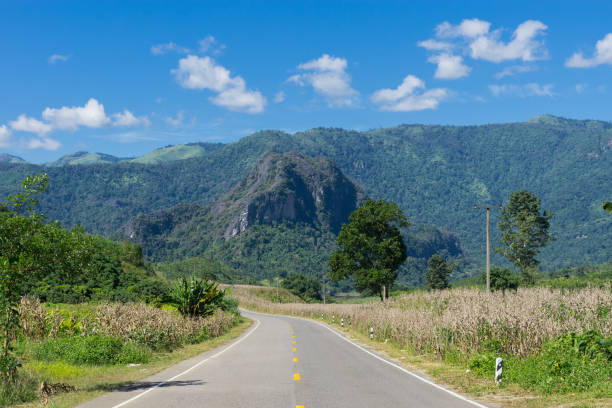 istock Street and mountain scenery with blue sky background 671899334