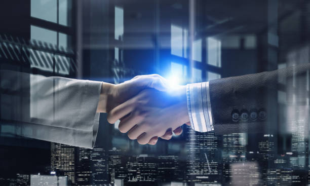 istock Partners shaking hands as symbol of deal . Mixed media 671909430