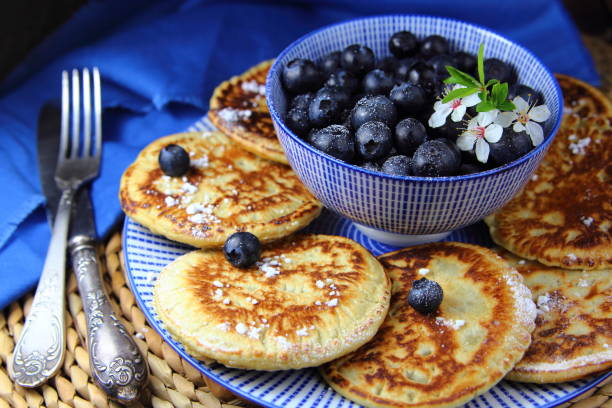 blueberry fritters pancakes with blueberries.breakfast apple cinnamon pancake stock pictures, royalty-free photos & images