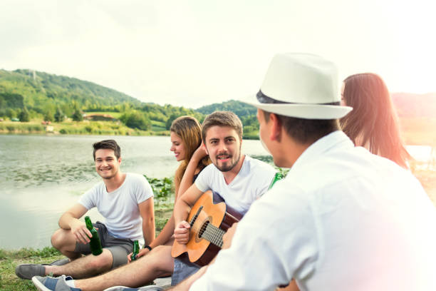 istock Happy Young people having party outdoor 671925908