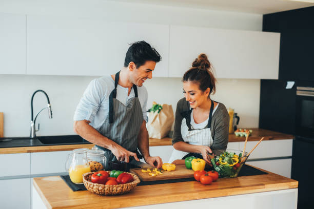 istock Young couple cooking in the kitchen 671935872