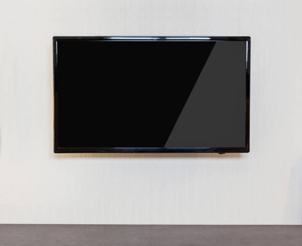 istock Modern living room with TV on the wall. 671941354
