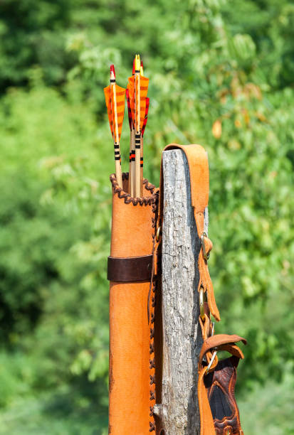 istock Arrows with colored plumage in the orange leather quiver 671947914