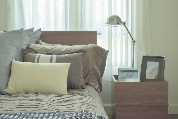 istock Linen pillows in difference size on bed in modern japanese style bedroom 671951646