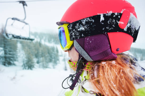istock Female skier enjoying beautiful mountain scene 671955740