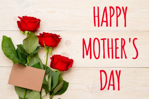 happy mother's day, text with red roses and craft paper card