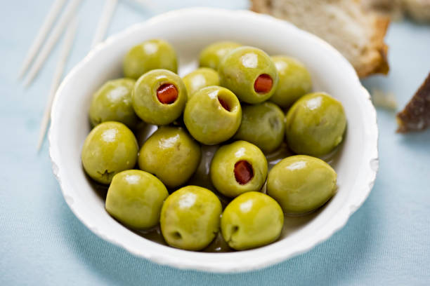 green olives stuffed red peppers - olive green olive stuffed food imagens e fotografias de stock