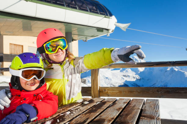 istock Skiers observing nature sitting at mountain cafe 671965044