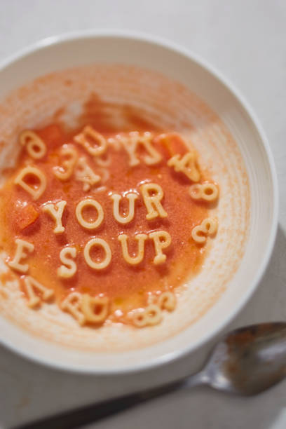 istock Tomato pasta soup with writing: Your soup 671965348