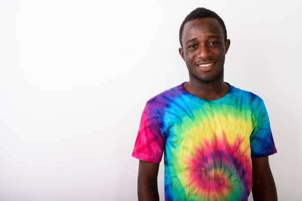 istock Studio shot of young black African man smiling against white background 671974598