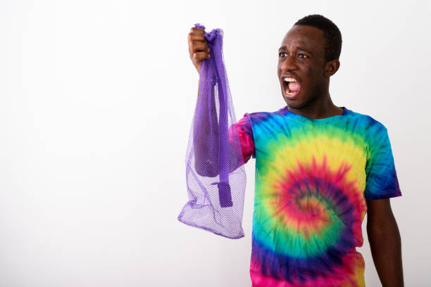 istock Studio shot of young black African man holding empty exercise mat net against white background 671975140