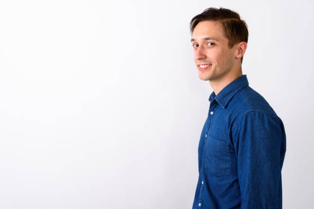 istock Studio shot of happy young handsome man smiling against white background 671981144