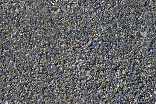 Old asphalt road. Close up