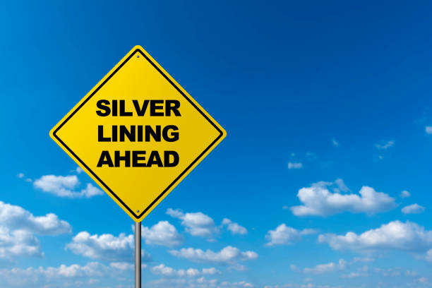 silver lining ahead  - road warning sign - every cloud has a silver lining imagens e fotografias de stock