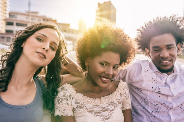 istock three beautiful young cuban people in open cabrio car in Havanna 671991612