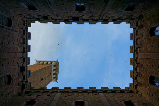 Inner yard and Torre del Mangia of  Palazzo Pubblico, Siena, Tuscany, Italy, wide angle shot