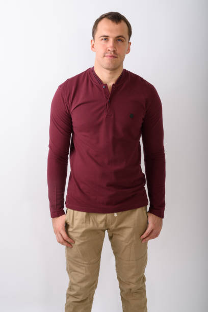 istock Studio shot of young muscular man standing against white background 671992688