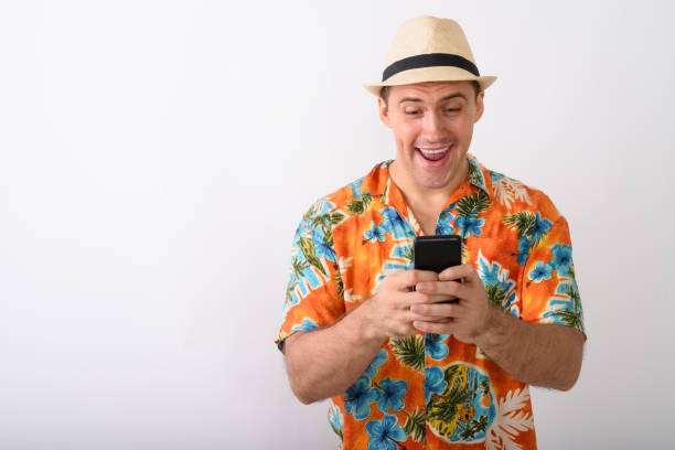 istock Tourist Man Wearing Hawaiian Shirt While Vlogging Using Mobile Phone 671995808