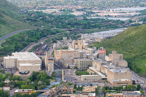 Golden, USA - May 26, 2016: Overlook of the Coors brewery in Colorado with several buildings, roads and tracks with cars and trains and a creek running through the facility.