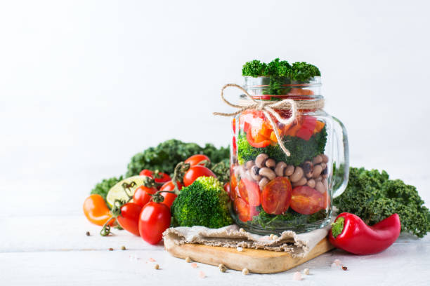 istock Healthy vegan salad in a mason jar with beans 672002934