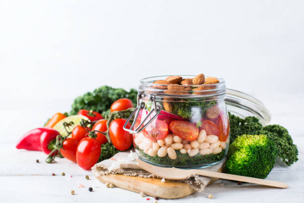 istock Healthy vegan salad in a mason jar with beans 672007366