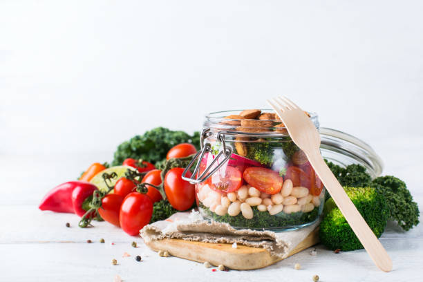 istock Healthy vegan salad in a mason jar with beans 672007464