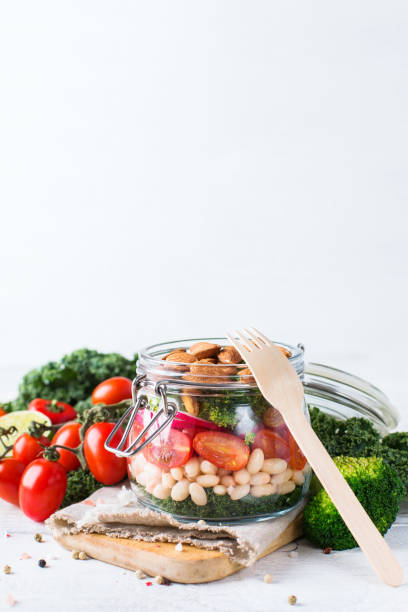 istock Healthy vegan salad in a mason jar with beans 672007552