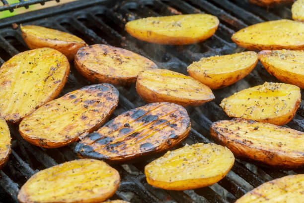 istock Potatoes, and meat roasted on skewers BBQ grill 672007584