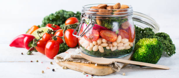 istock Healthy vegan salad in a mason jar with beans 672008816