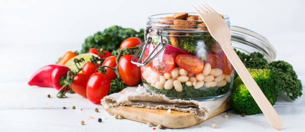 istock Healthy vegan salad in a mason jar with beans 672010886