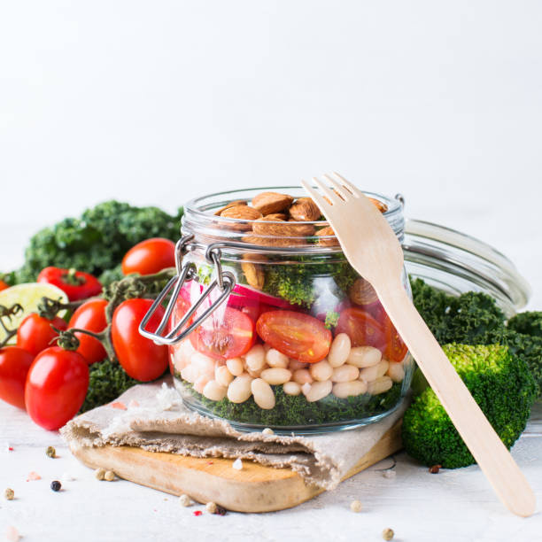 istock Healthy vegan salad in a mason jar with beans 672010970