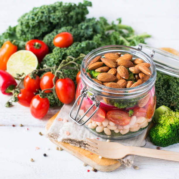 istock Healthy vegan salad in a mason jar with beans 672011054