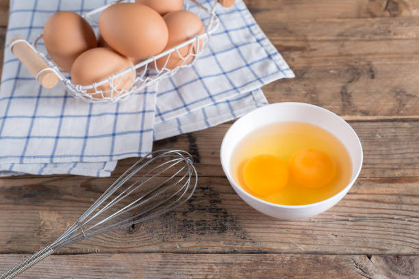 istock Egg yolk for cooking on white bowl. 672011334