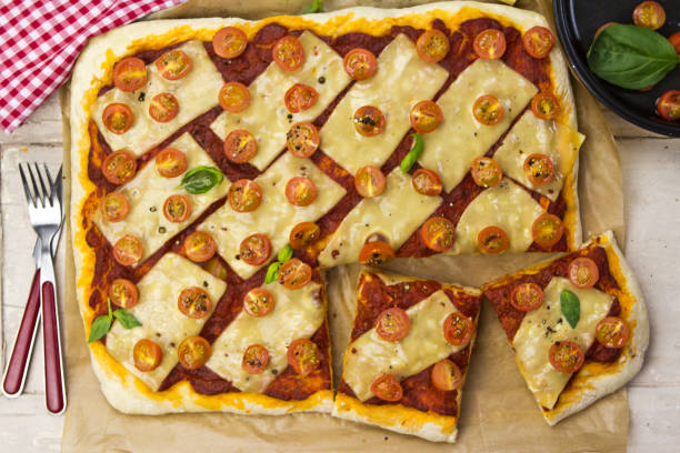 istock Margarita pizza on wooden table 672011766