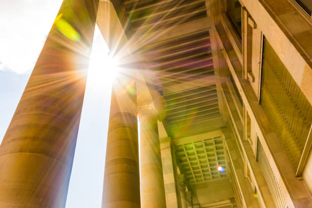 istock Sun Flare through European Roman Columns Historic Brown Bright 672015134