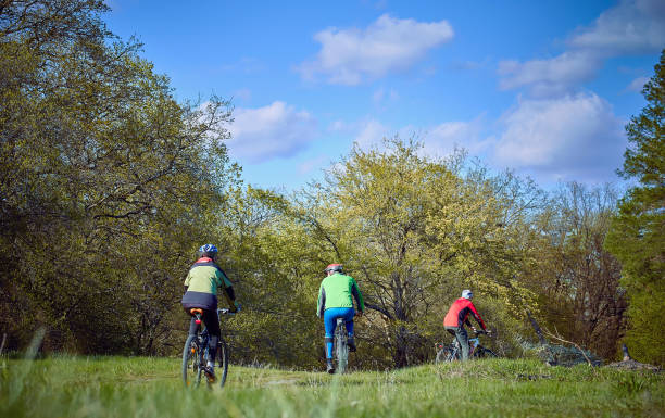 istock Walking a bike through the forest in the spring. 672016260